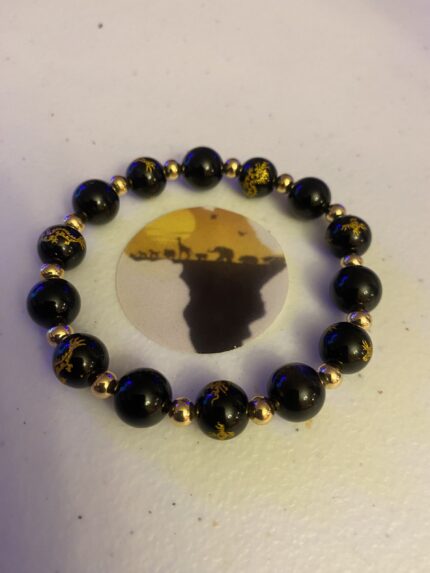 Command Attention with this Bold Black and 14k Gold Statement Bracelet!